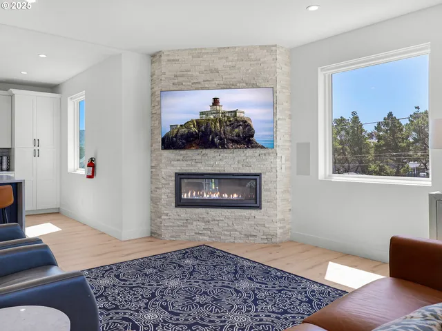 a living room with a fireplace and a rug