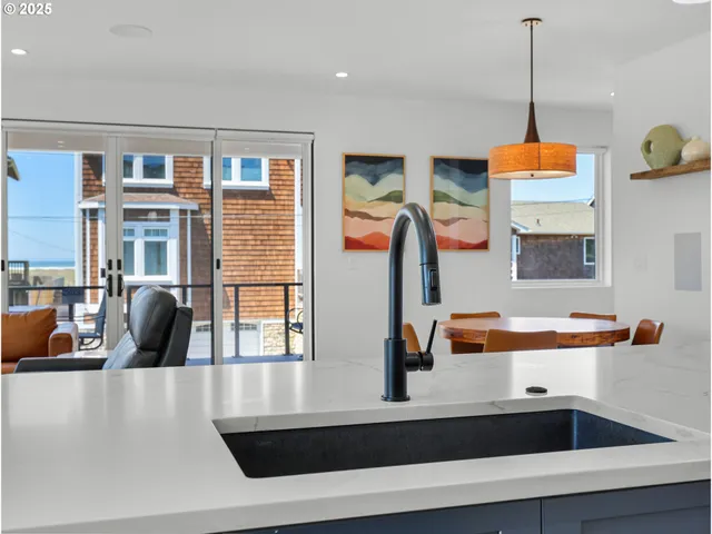 a kitchen with a refrigerator and a sink