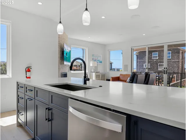 a large kitchen with a table and chairs