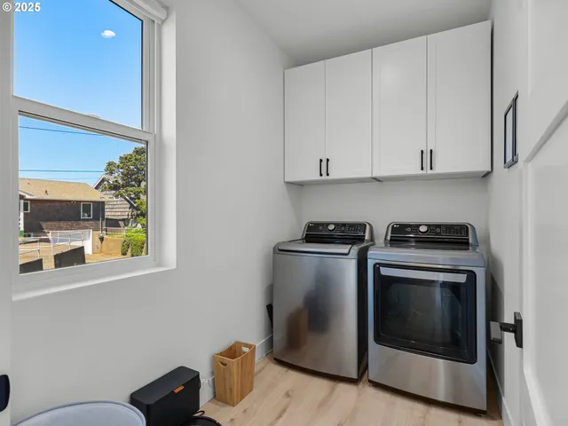 a view of a kitchen with washer and dryer
