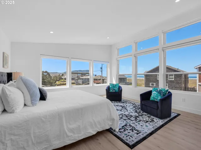 a bedroom with a large bed and a couch