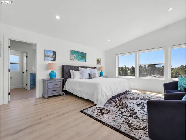 a bedroom with a large bed and a couch