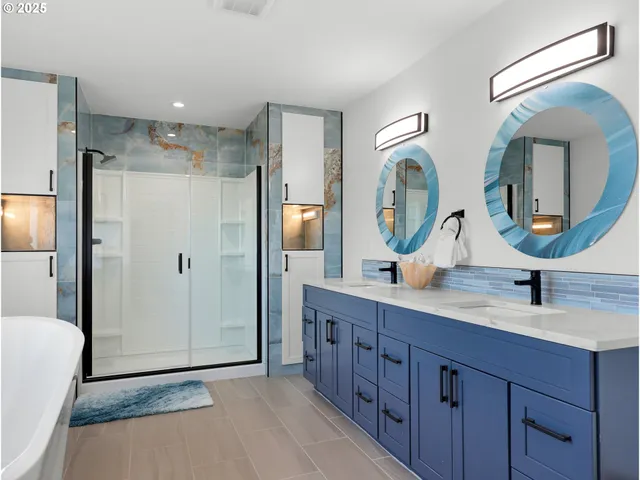 a spacious bathroom with a double vanity sink and a mirror