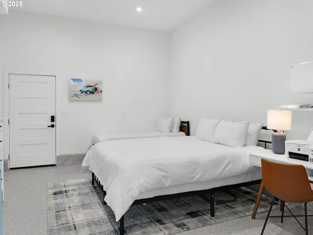 a bedroom with a bed and a dresser