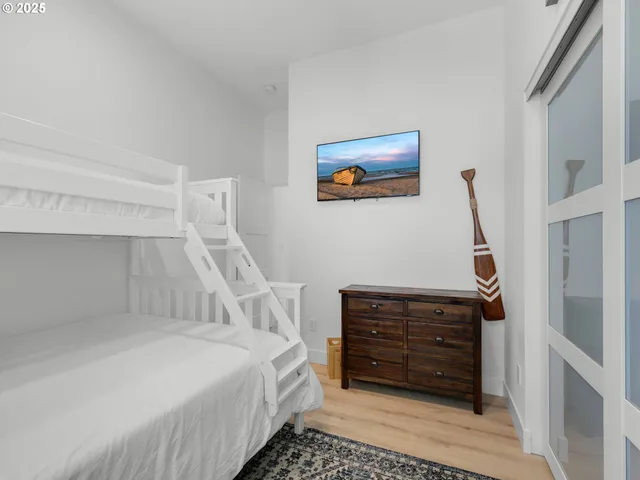 a bedroom with a bed and a cabinets