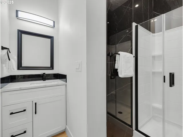 a bathroom with a mirror sink and vanity