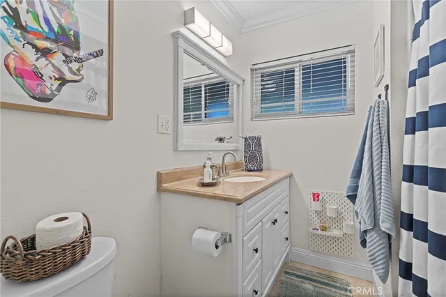 a bathroom with a sink a vanity and a mirror