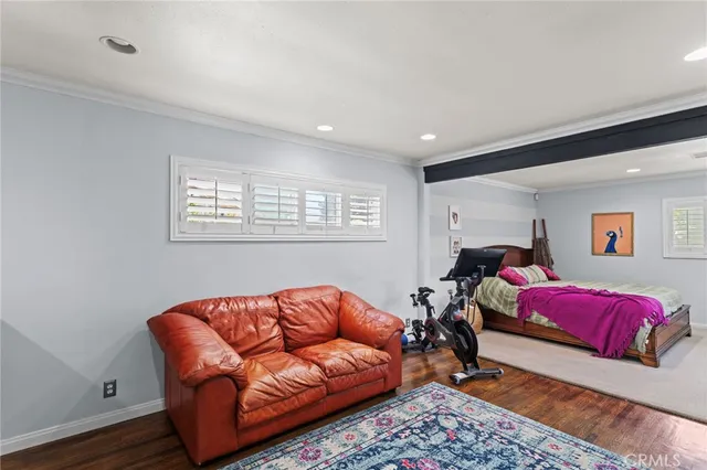 a living room with furniture a ceiling fan and a window
