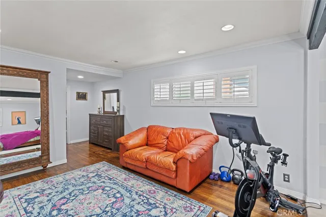 a living room with furniture a rug and a window