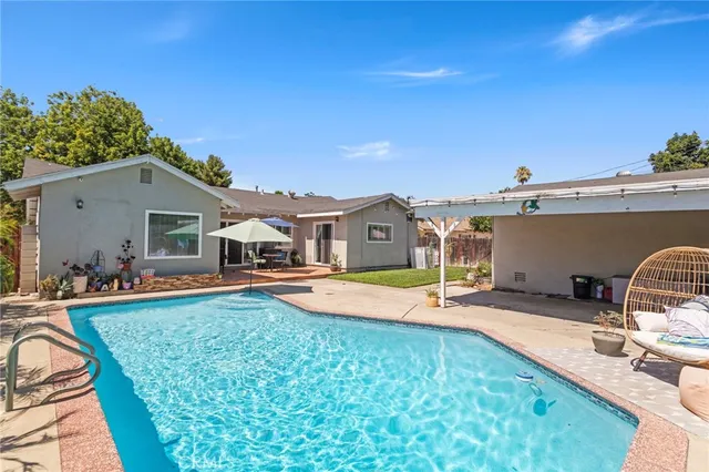 swimming pool view with seating space