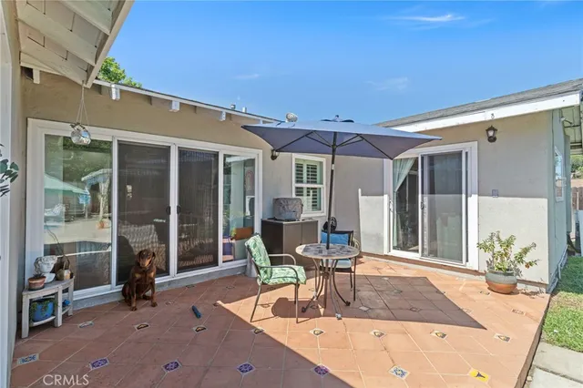 a dining room with furniture and a yard