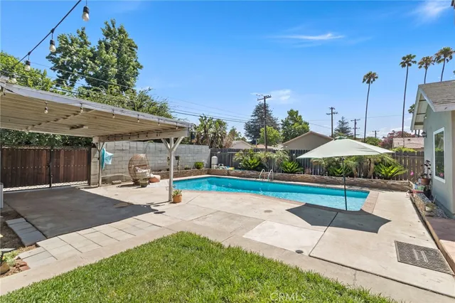 a view of a patio with a table and chairs