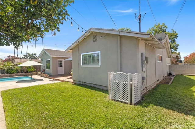a view of a garden with plants and a fountain