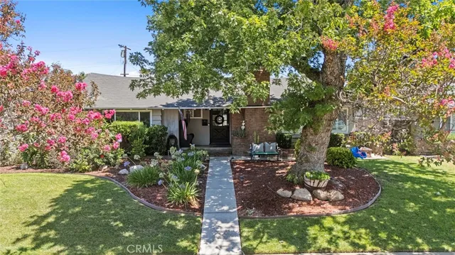 an aerial view of multiple houses with yard