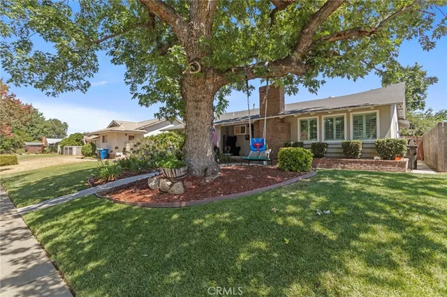 a view of multi story residential apartment building with a yard