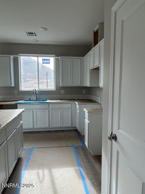 8510 Wicket Drive, Unit LOT 45 Reno, NV 89506 - Photo 2 of 4 a kitchen with a sink window and cabinets