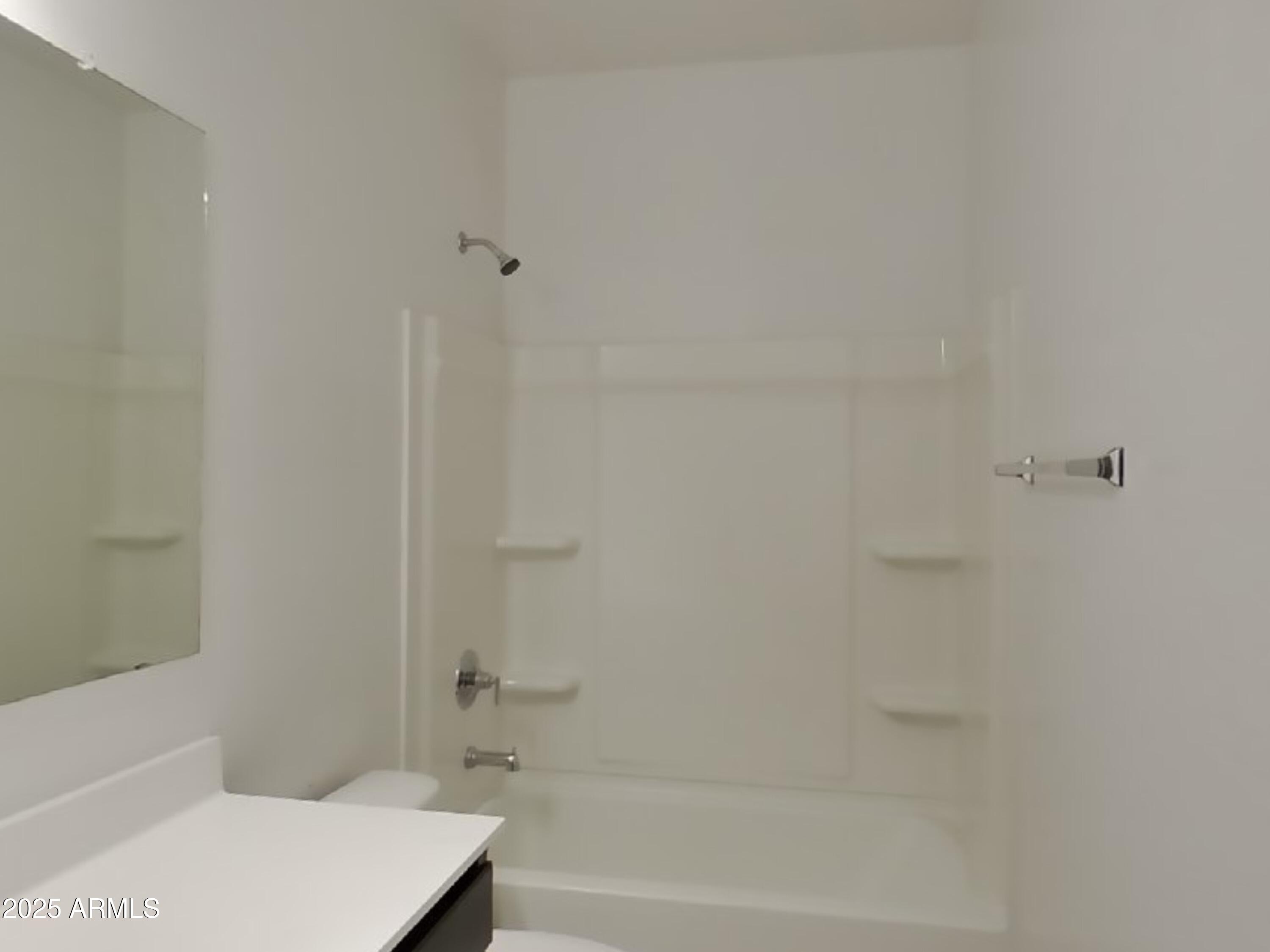 5288 Iridium Way San Tan Valley, AZ 85143 - Photo 13 of 16 a bathroom with a bathtub and a toilet