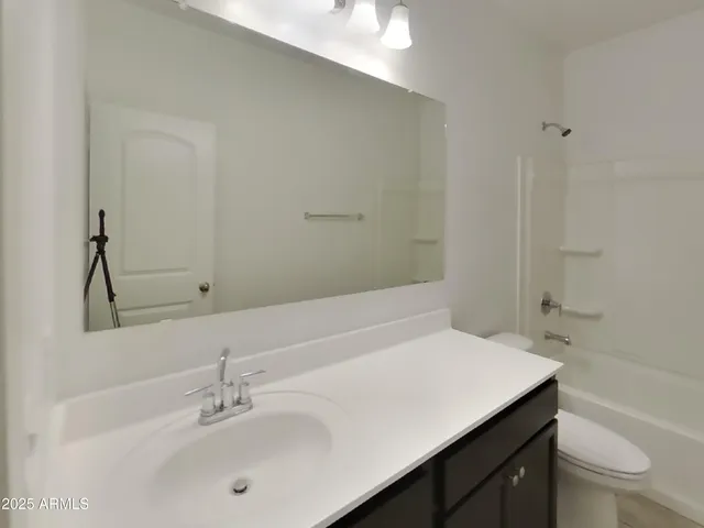 a bathroom with a bathtub and a toilet