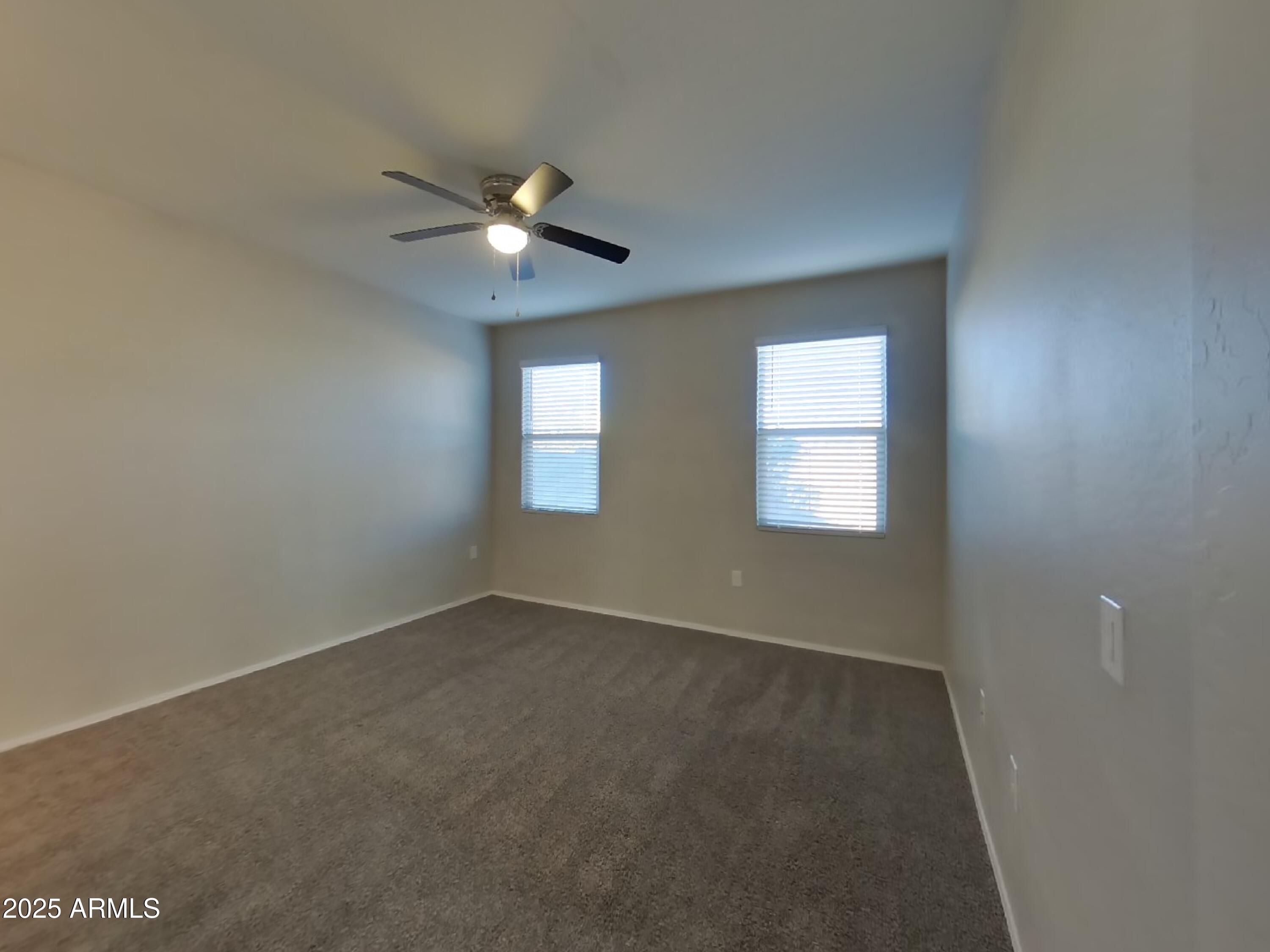 5288 Iridium Way San Tan Valley, AZ 85143 - Photo 6 of 16 a view of an empty room with a window