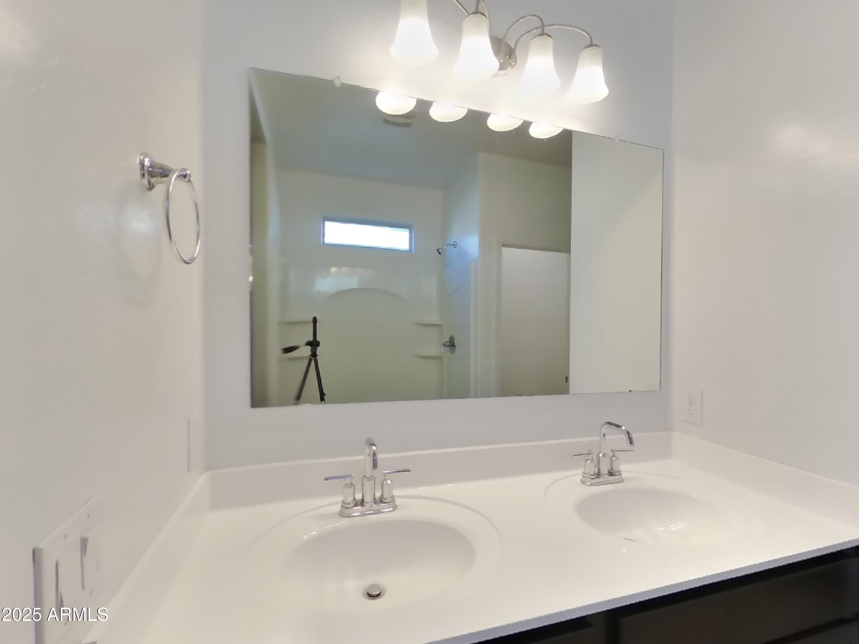5288 Iridium Way San Tan Valley, AZ 85143 - Photo 8 of 16 a bathroom with a sink double vanity and a mirror