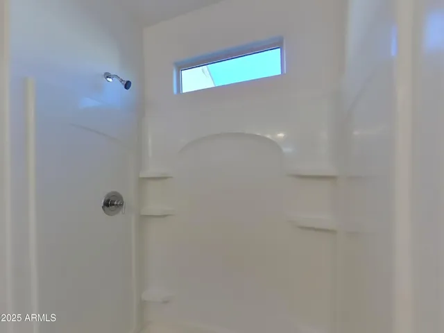 a bathroom with a sink double vanity and a mirror