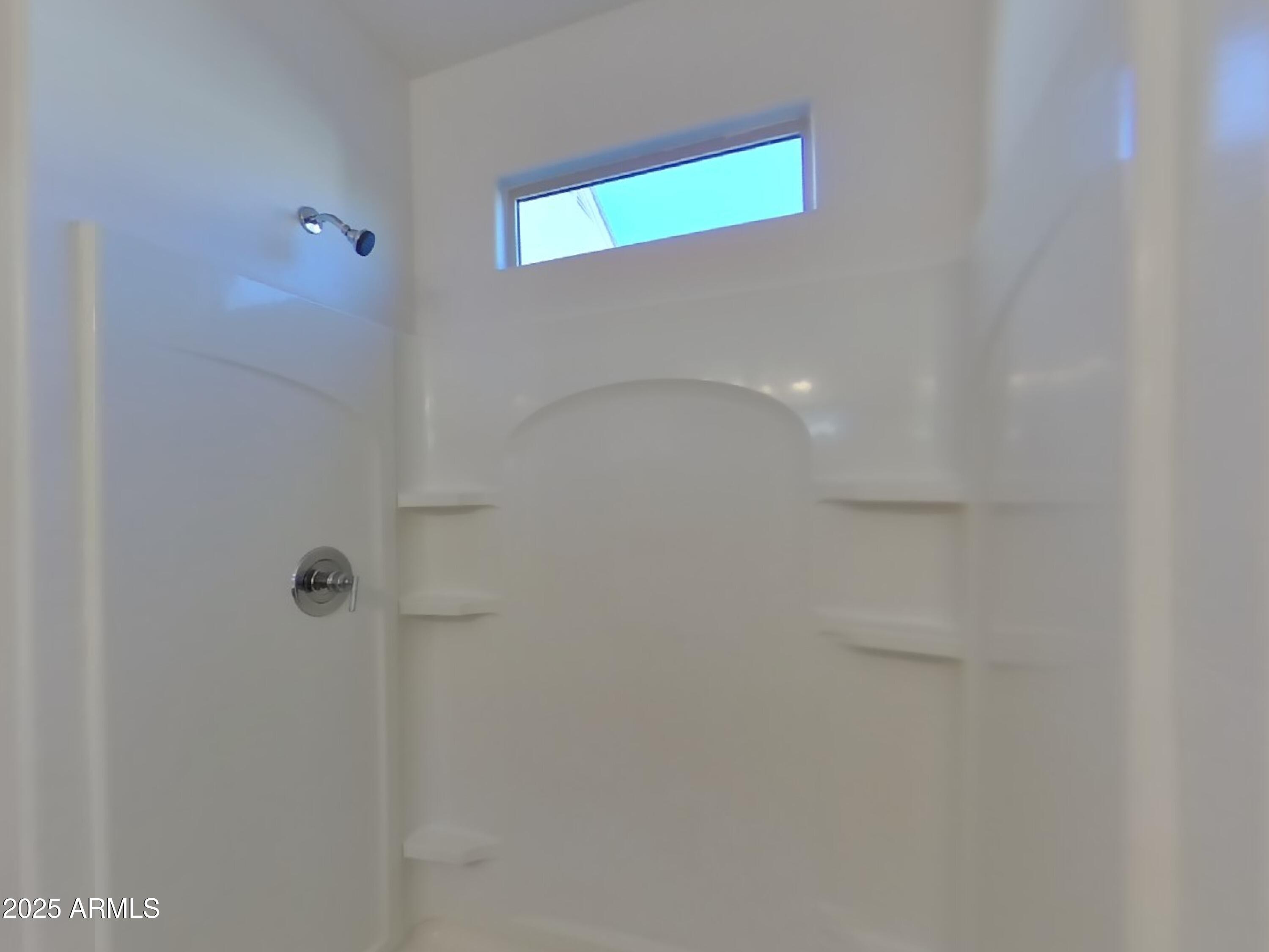 5288 Iridium Way San Tan Valley, AZ 85143 - Photo 9 of 16 a bathroom with a shower