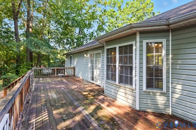 a view of a house with a yard from a lake view