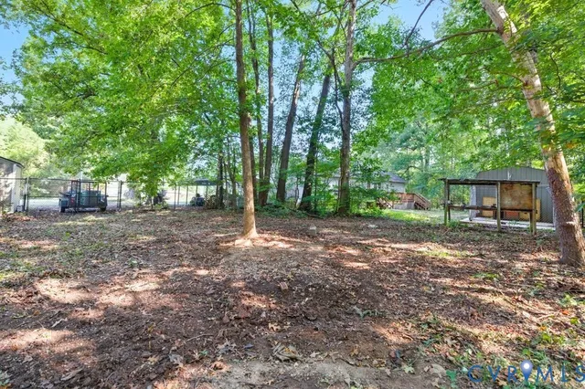 a view of balcony with wooden floor and fence