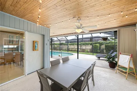 a view of a patio with a table and chairs