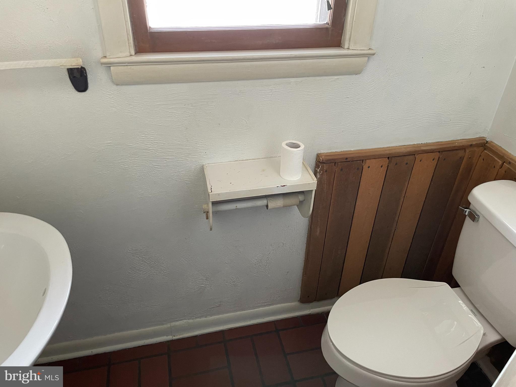 60 Ridge Road Gettysburg, PA 17325 - Photo 16 of 41 a white toilet sitting next to a small bathroom