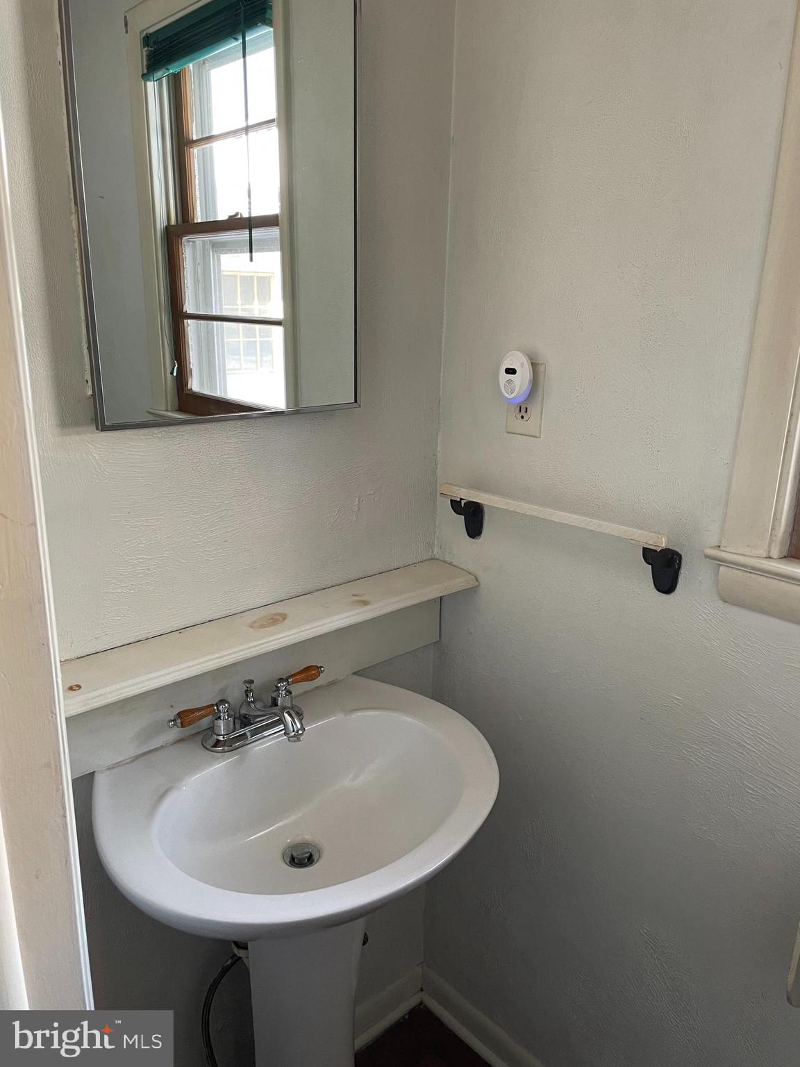 60 Ridge Road Gettysburg, PA 17325 - Photo 17 of 41 a bathroom with a sink and a window