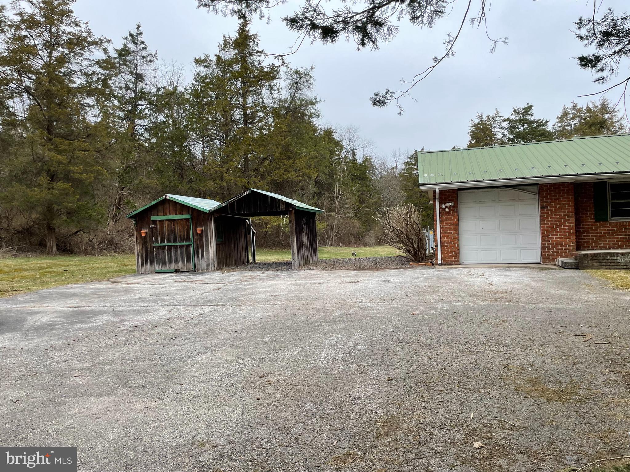 60 Ridge Road Gettysburg, PA 17325 - Photo 9 of 41 a front view of a house with a yard and garage