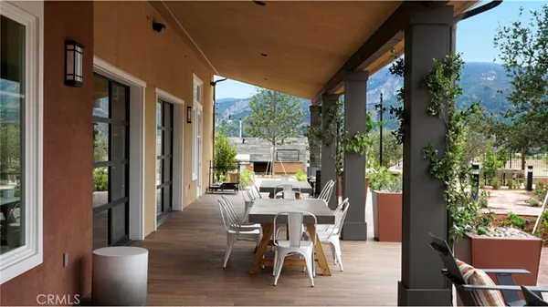 a dining room with furniture and wooden floor