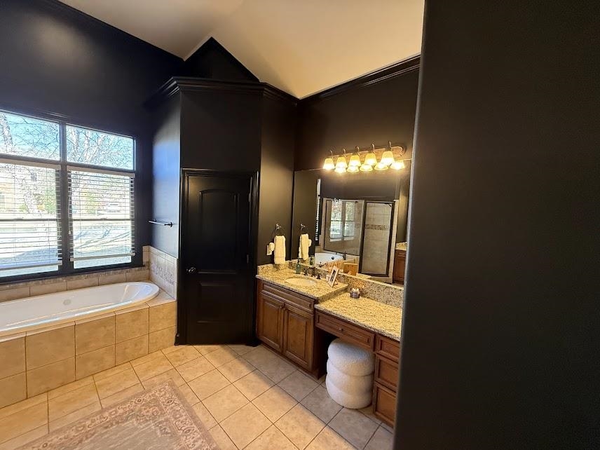 1307 Bull Creek Lane Collierville, TN 38017 - Photo 11 of 30 Bathroom featuring vanity, a bath, light tile patterned floors, crown molding, and vaulted ceiling