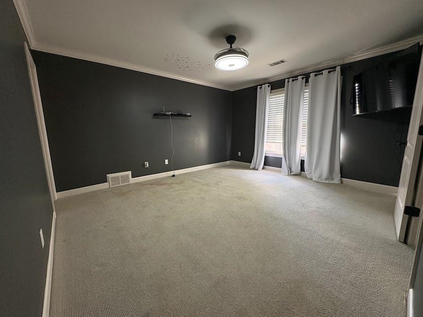 1307 Bull Creek Lane Collierville, TN 38017 - Photo 24 of 30 Spare room featuring ornamental molding and light carpet