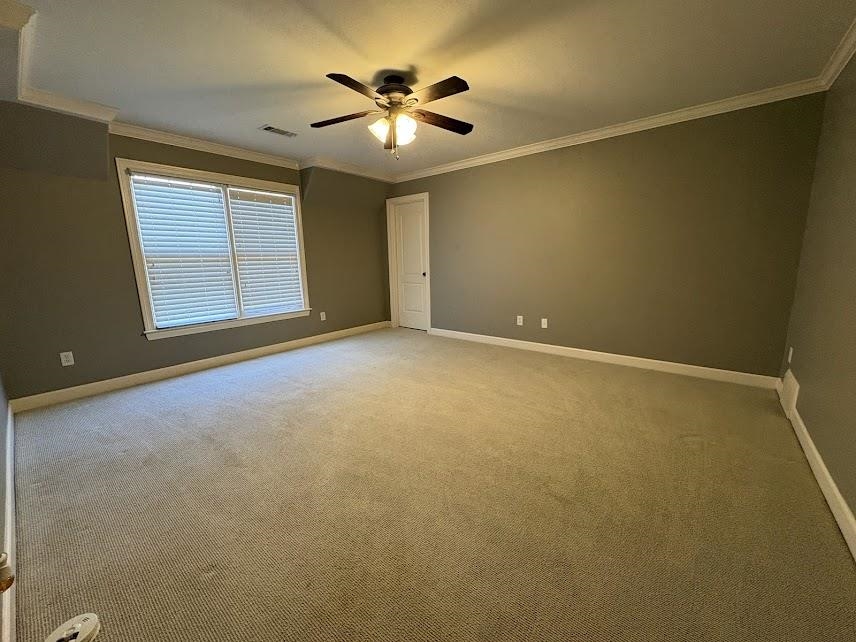 1307 Bull Creek Lane Collierville, TN 38017 - Photo 26 of 30 Carpeted spare room with crown molding and a ceiling fan
