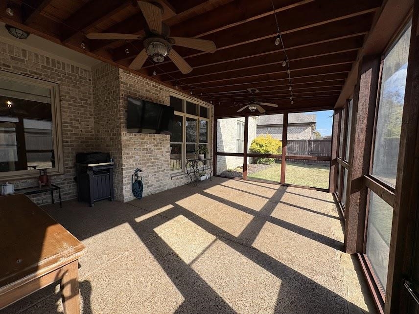 1307 Bull Creek Lane Collierville, TN 38017 - Photo 28 of 30 Unfurnished sunroom featuring ceiling fan and beam ceiling