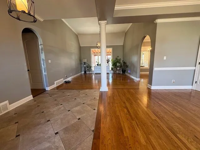 a view of a living room and a chandelier