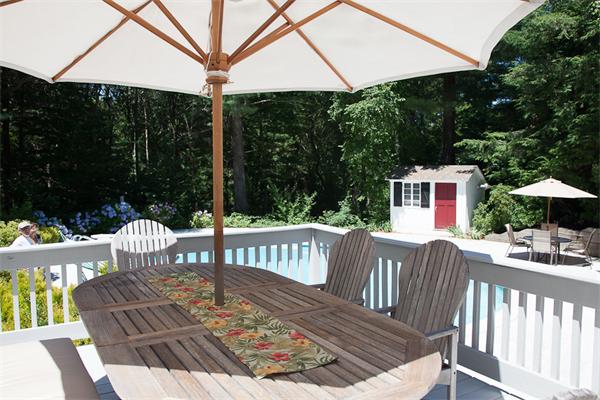 39 Mast Hill Road Hingham, MA 02043 - Photo 3 of 13 a view of a wooden chairs and table in the patio