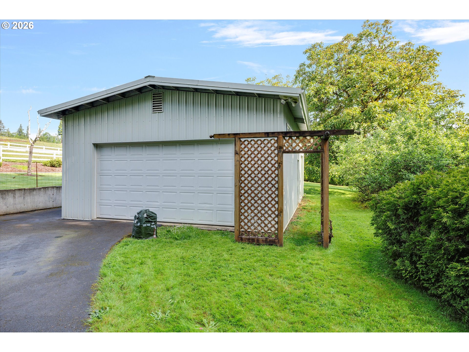 30185 Southeast Wheeler Road Boring, OR 97009 - Photo 18 of 27 a backyard of a house with lots of green space