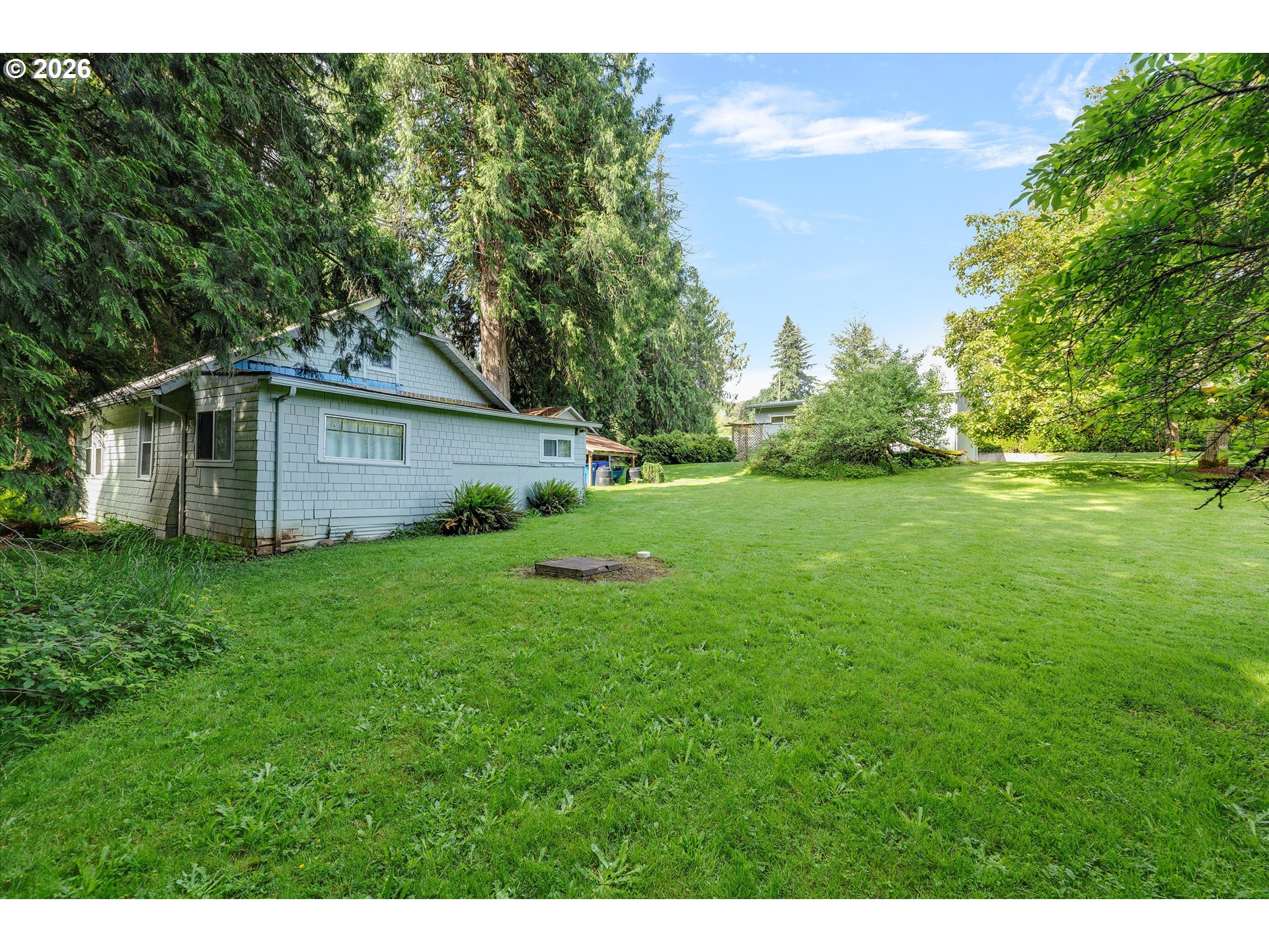 30185 Southeast Wheeler Road Boring, OR 97009 - Photo 24 of 27 a view of a backyard with a garden