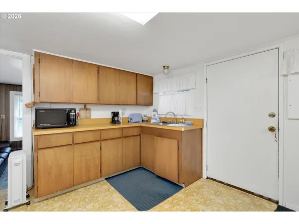 a kitchen with stainless steel appliances granite countertop a sink and cabinets