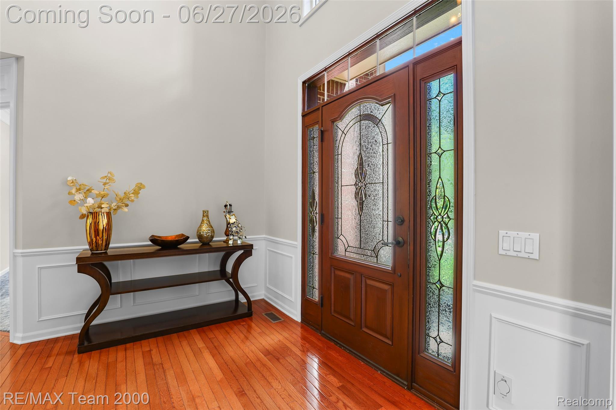 1248 Lasalle Road Canton, MI 48187 - Photo 19 of 67 Grand entryway featuring a solid wood door with decorative glass inserts, sidelights, and a transom window