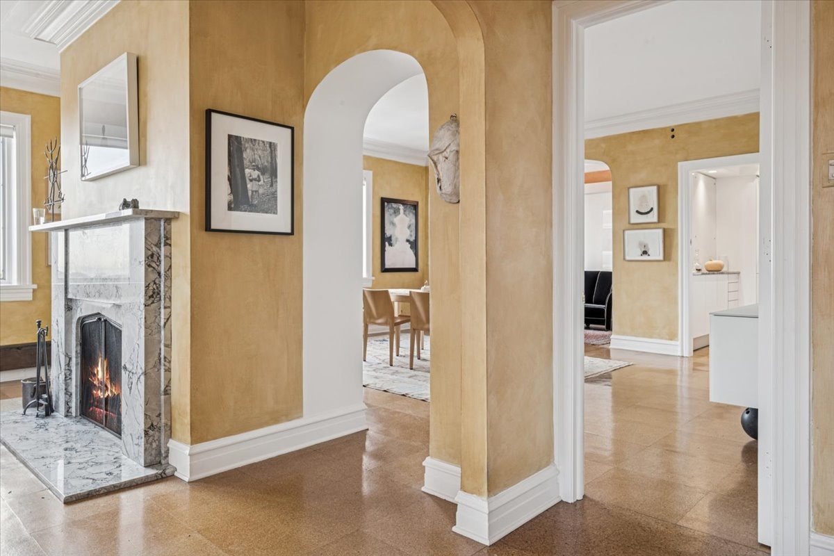 707 West Jr Terrace, Unit 10 Chicago, IL 60613 - Photo 11 of 42 a view of a livingroom with wooden floor and a fireplace