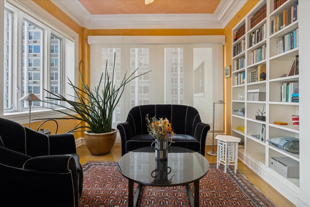 707 West Jr Terrace, Unit 10 Chicago, IL 60613 - Photo 13 of 42 a living room with furniture potted plant and a large window