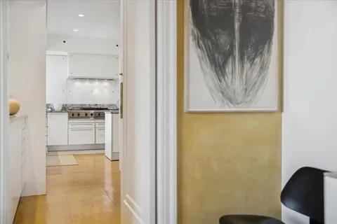 a kitchen with stainless steel appliances granite countertop a sink and cabinets