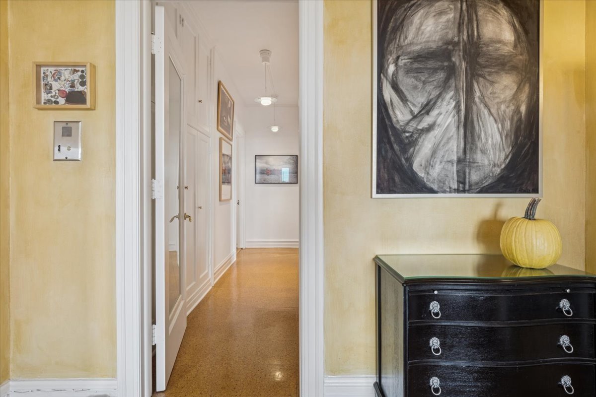707 West Jr Terrace, Unit 10 Chicago, IL 60613 - Photo 25 of 42 a view of a hallway to a room with wooden floor