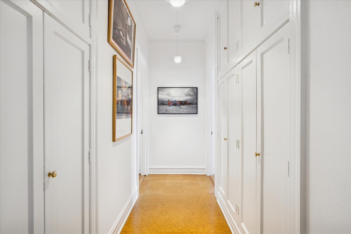 707 West Jr Terrace, Unit 10 Chicago, IL 60613 - Photo 26 of 42 a view of a hallway with wooden floor and staircase