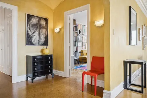 a view of room with furniture and wooden floor