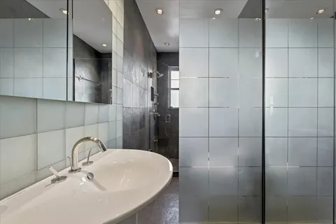 a lamp on a counter top a sink